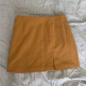Yellow mini skirt with small side slit size small